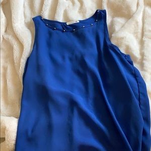 Tank. Open back . Studded neck line